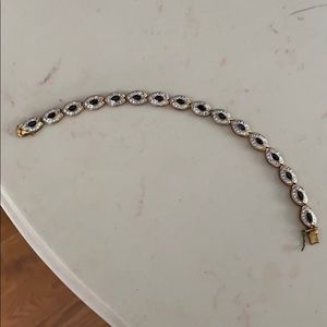 Gold, silver, and black bracelet